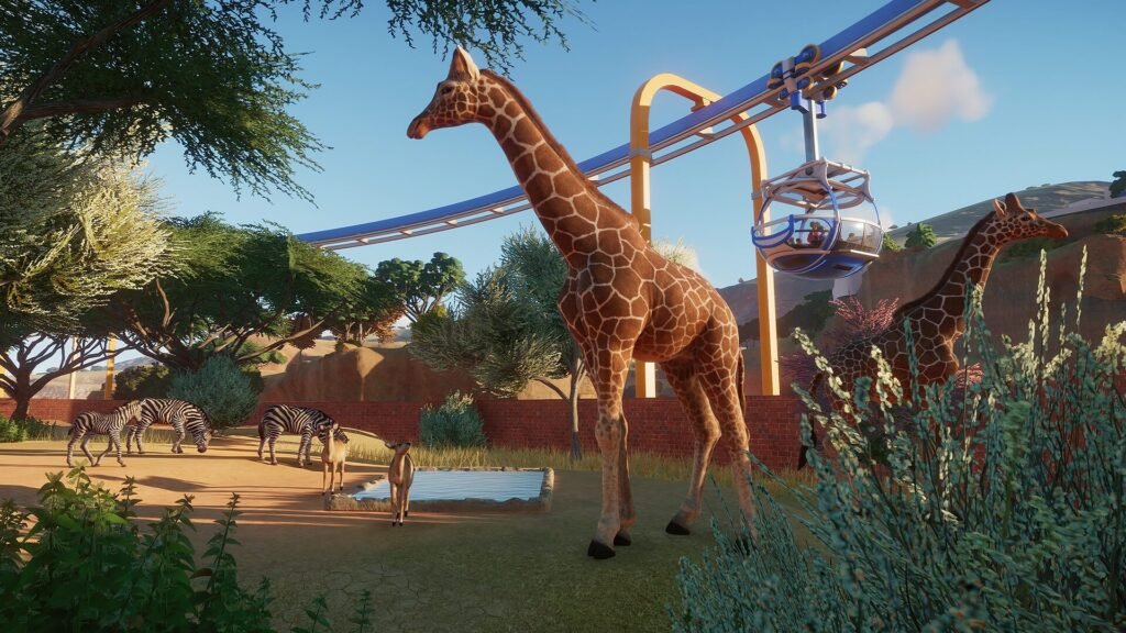 A zoo habitat with animals and guests inside Planet Zoo.